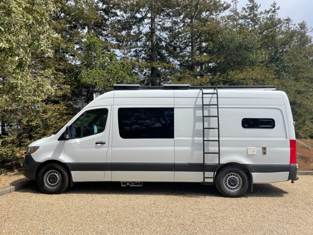Side view of van with ladder